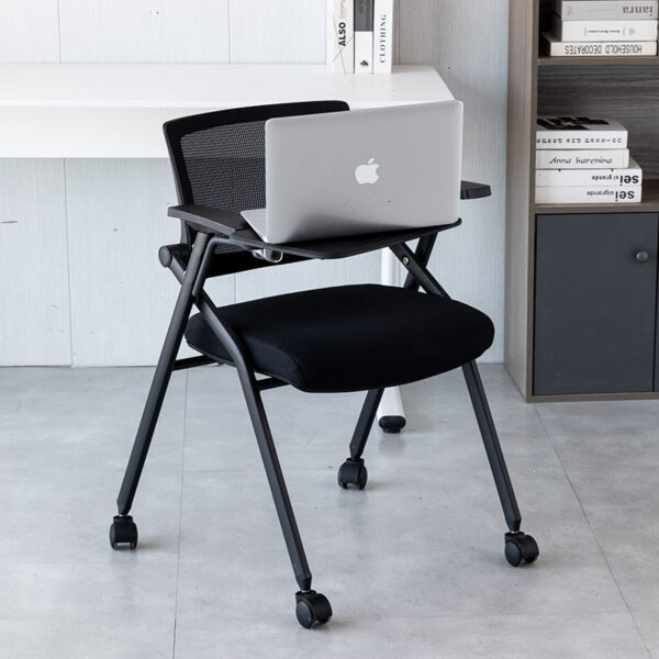 Folding training chair with writing desk for meetings and conferencesThis image shows a folding training chair with an attached writing desk. Ideal for office meetings, conferences, or training sessions, this versatile chair provides ergonomic support and space-saving functionality.